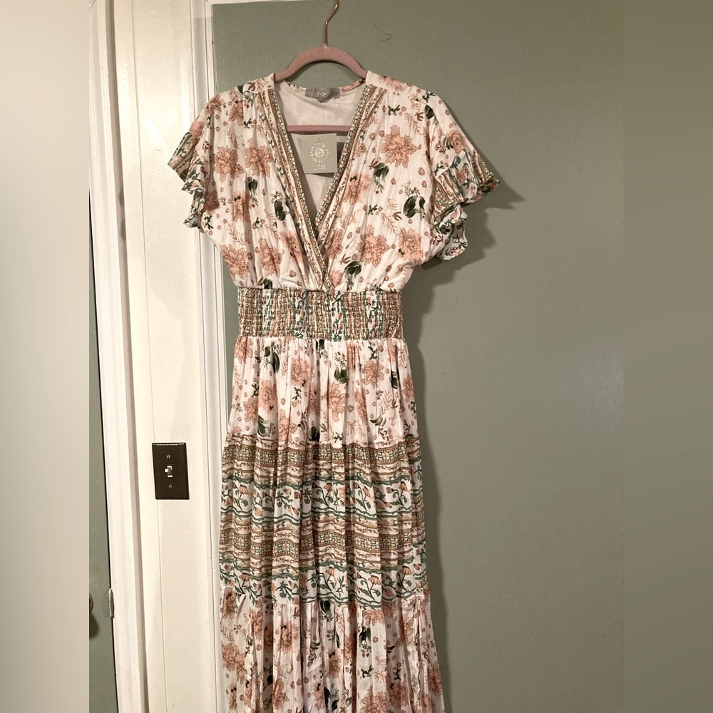 Boutique dress new with tags. Never worn.axis dress.